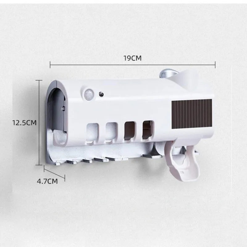 Black and white intelligent UV toothbrush steriliser with automatic toothpaste squeezer mounted on a bathroom wall.