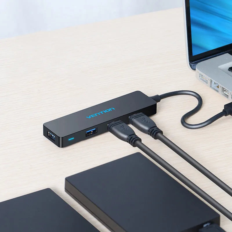 Black USB 3.0 four-port hub with 0.15m cable and nickel-plated connectors