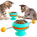 Rotatable cat toy with catnip balls in transparent compartment and large suction cup base