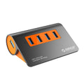 Dark grey and orange aluminium USB-C laptop docking hub with four USB 3.1 ports and a detachable data cable