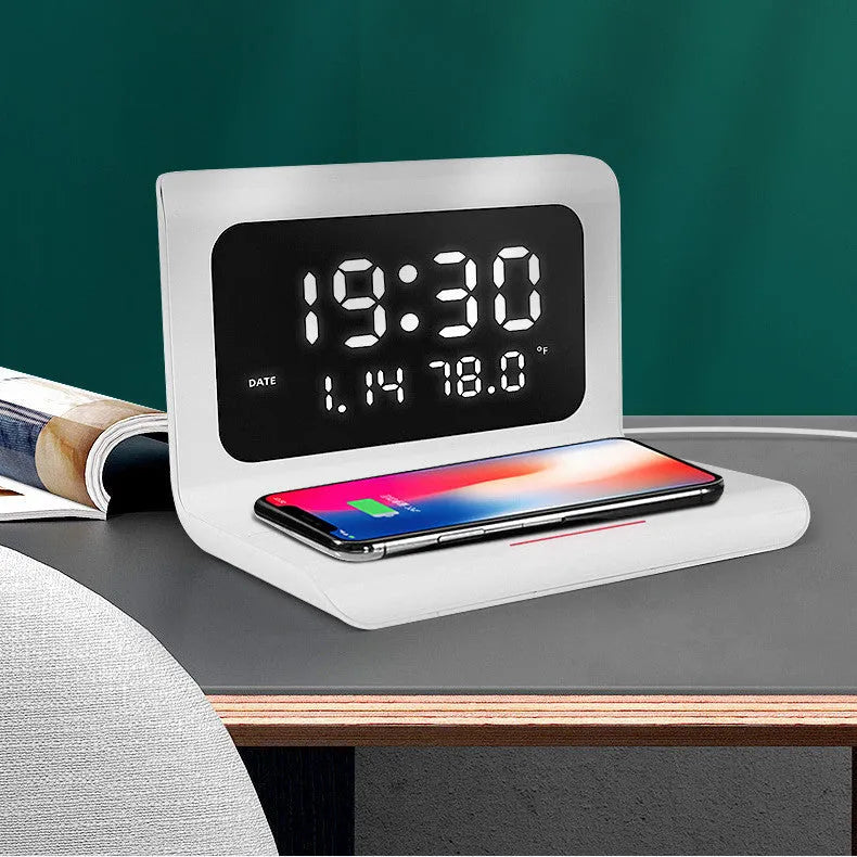 White wireless charger alarm clock displaying time, calendar, temperature and humidity readings