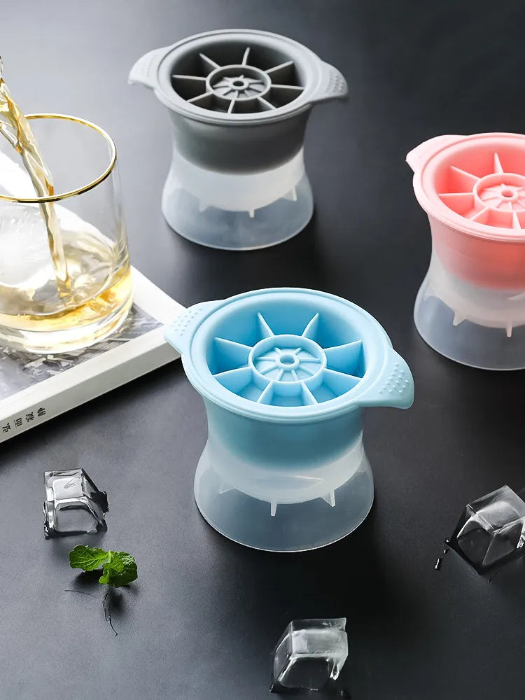 Flexible silicone ice tray producing large hockey puck-shaped ice cubes in various colours.