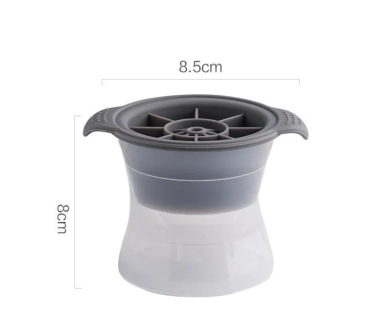 Flexible silicone ice tray producing large hockey puck-shaped ice cubes in various colours.