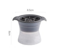 Flexible silicone ice tray producing large hockey puck-shaped ice cubes in various colours.