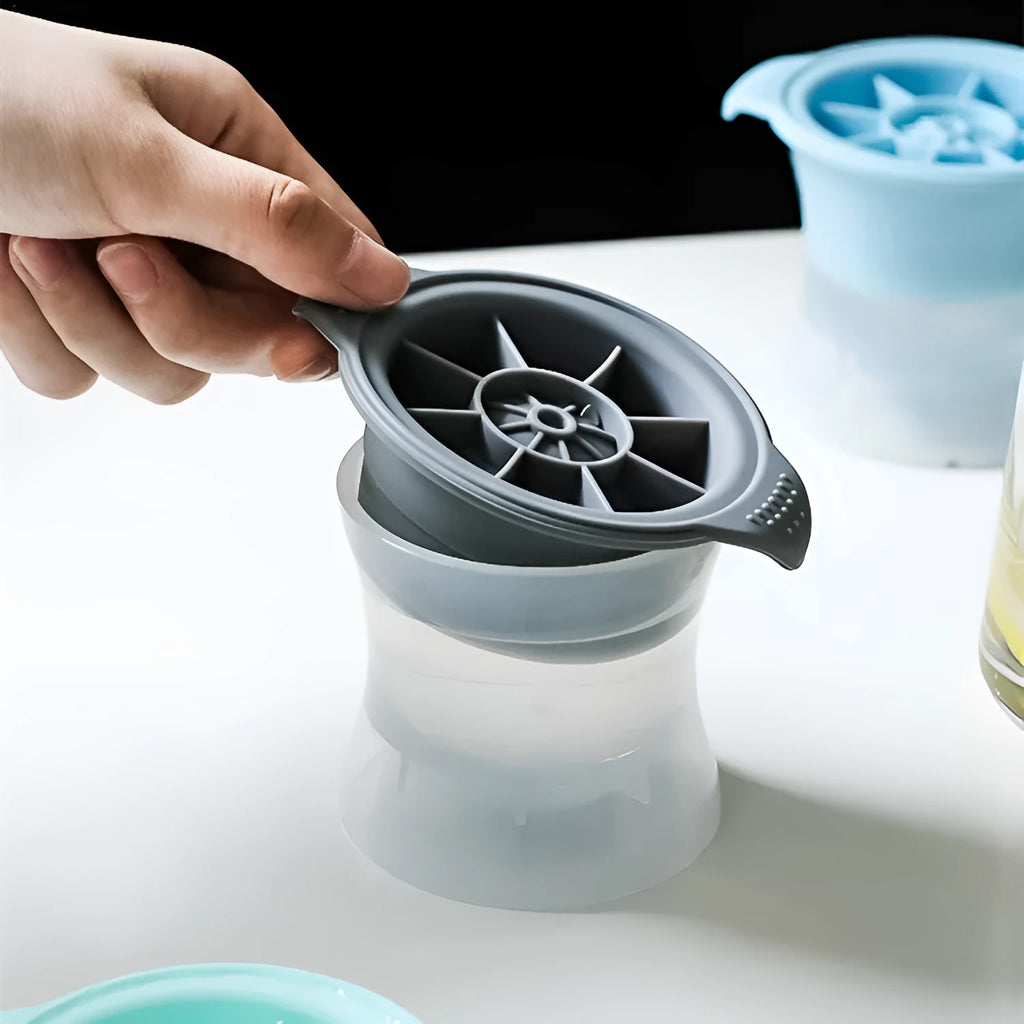 Flexible silicone ice tray producing large hockey puck-shaped ice cubes in various colours.
