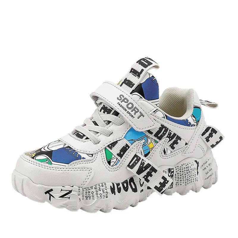 Blue and white boys sports sneakers with Velcro fastening showing rubber sole