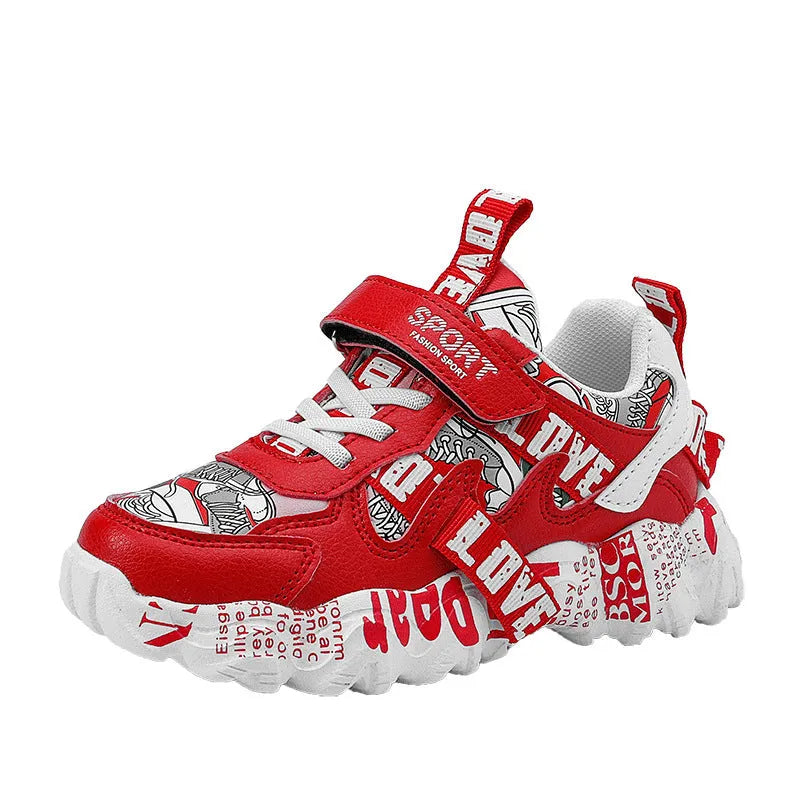Blue and white boys sports sneakers with Velcro fastening showing rubber sole