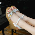 Women's pink wedge sandals with a thick heel, one-strap buckle, and a non-slip sole.