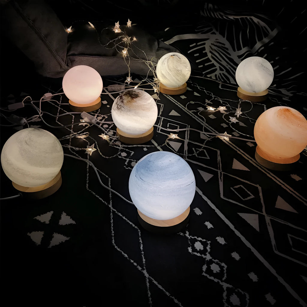 Nordic style planet light table lamp with glass shade in one of seven colour options, showing USB cable and button switch