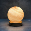 Nordic style planet light table lamp with glass shade in one of seven colour options, showing USB cable and button switch