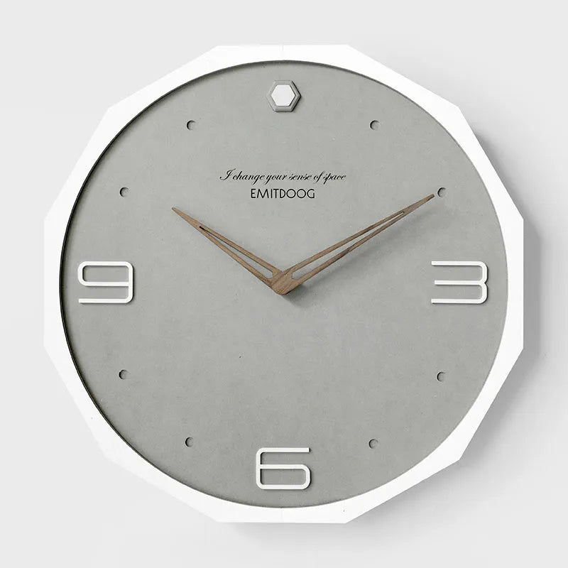 12-inch round Nordic minimalist wall clock with perforated metal face in a choice of four colours.