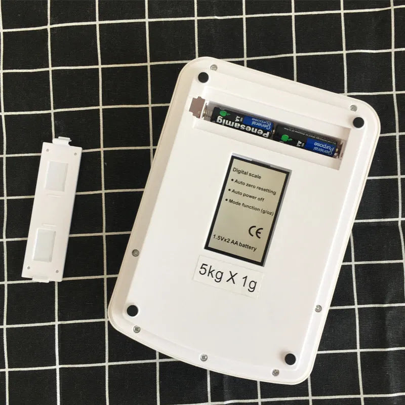 SF-400A black digital kitchen scale on a countertop showing a weight reading.