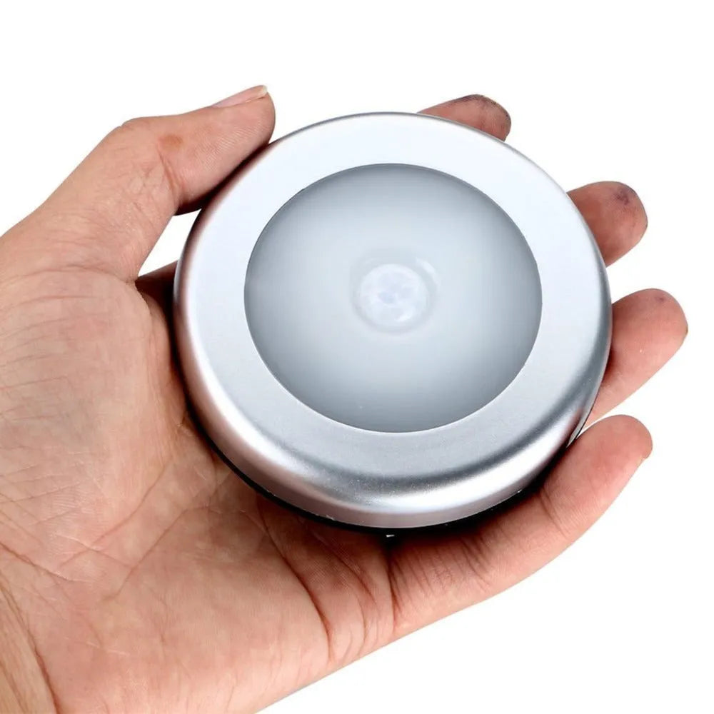 Silver square motion sensor night light with automatic activation for dark home areas