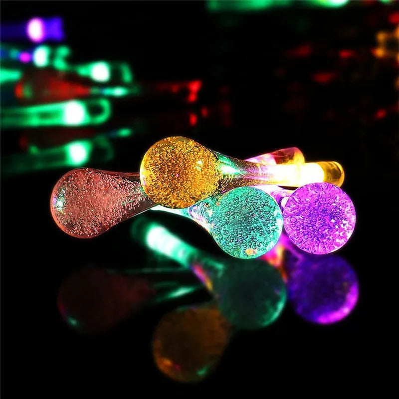 Solar-powered outdoor LED string lights with bubble drop pendants on 6.5 metre cable