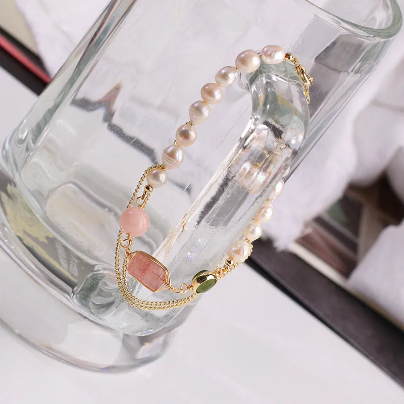 Women's pink bracelet with geometric strawberry crystal and natural freshwater pearls.