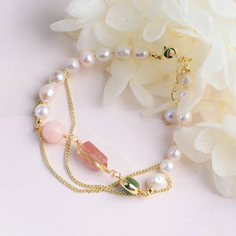 Women's pink bracelet with geometric strawberry crystal and natural freshwater pearls.