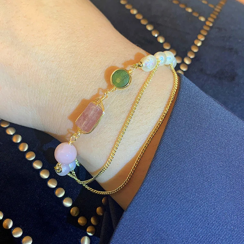 Women's pink bracelet with geometric strawberry crystal and natural freshwater pearls.