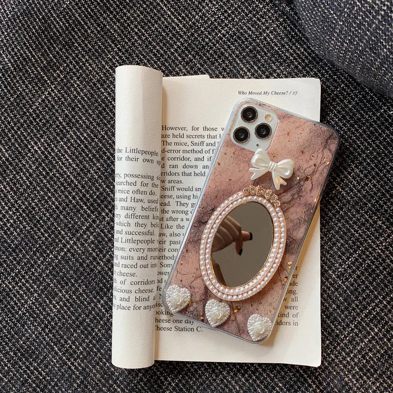 Brown marble pattern iPhone case with rhinestone bowknot and mirror finish.
