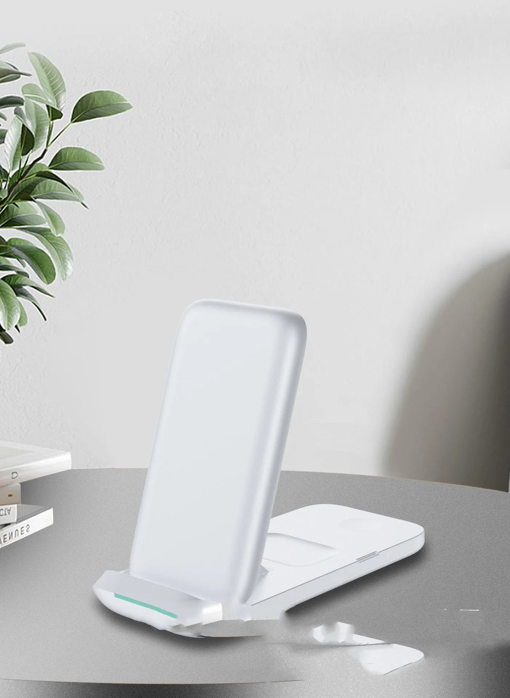 Black foldable three-in-one wireless charger for iPhone, Samsung Galaxy and AirPods showing charging areas