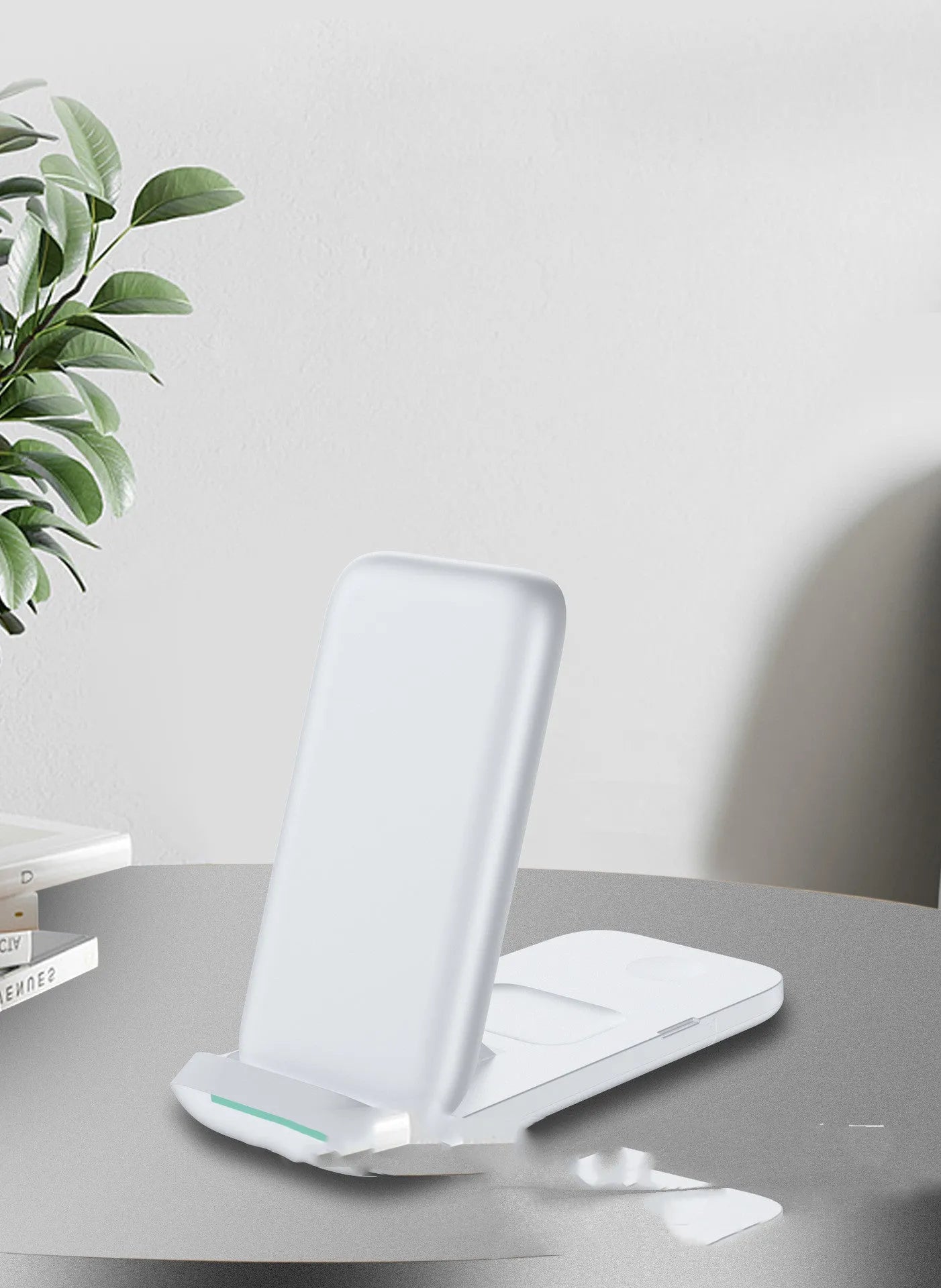 Black foldable three-in-one wireless charger for iPhone, Samsung Galaxy and AirPods showing charging areas