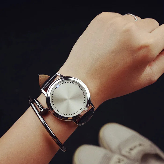 Electronic digital watch with blue light display showing numbers, available in black and white colour options