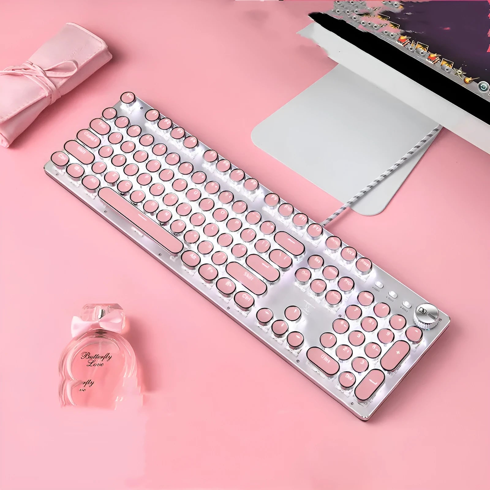 Silver mechanical keyboard with pink accents, green switches, and white LED backlighting