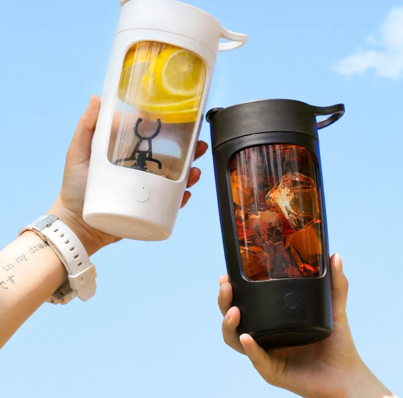 Portable rechargeable blender cup in black, blue, pink, and white colours, showing 650ml capacity and compact size.