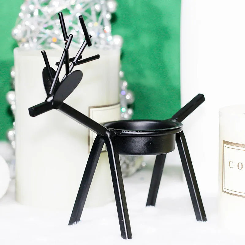 Black iron Christmas candlestick with deer or elk design for candle holding