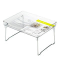 White plastic kitchen supplies rack holding bottles and jars on a countertop