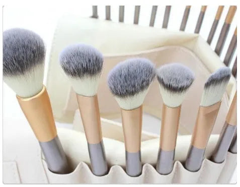 Persian makeup brush set with rice white brush heads and champagne colour handles in professional brush roll