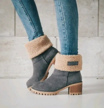 Women's mid-calf suede snow boots in black with a thick flat heel and round toe.