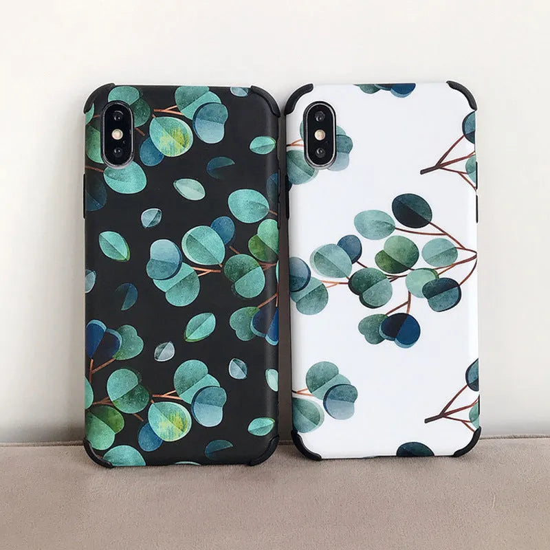 Black silicone iPhone case featuring a decorative leaf print design on the back.