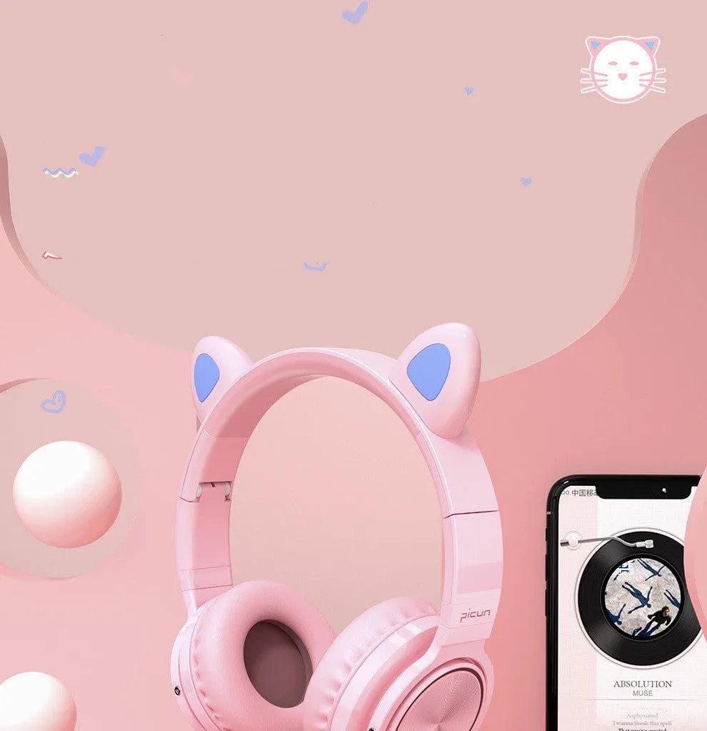 Pink and white wireless Bluetooth headphones with head-mounted design and braided cable
