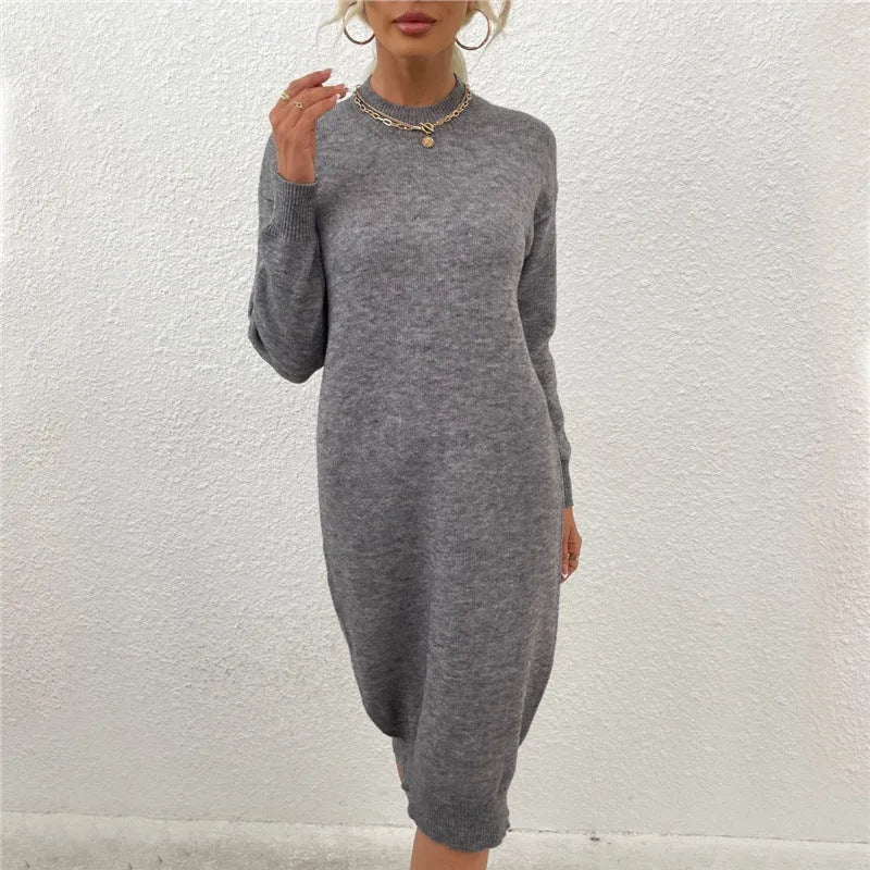 Women's grey crew neck acrylic sweater dress with long sleeves on hanger