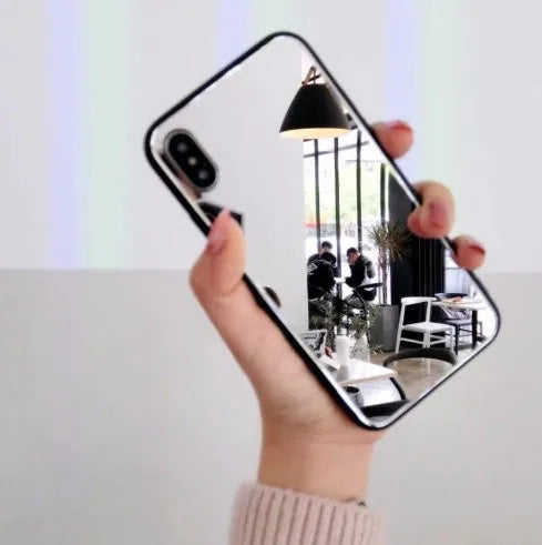 Black iPhone case with a reflective mirror surface on the back, compatible with iPhone X, 7, and 8 Plus.