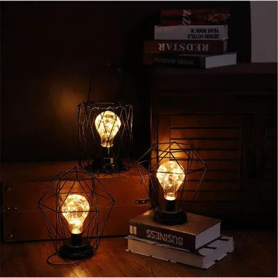 Minimalist hollow iron table lamp in wine bottle design with warm white LED lighting