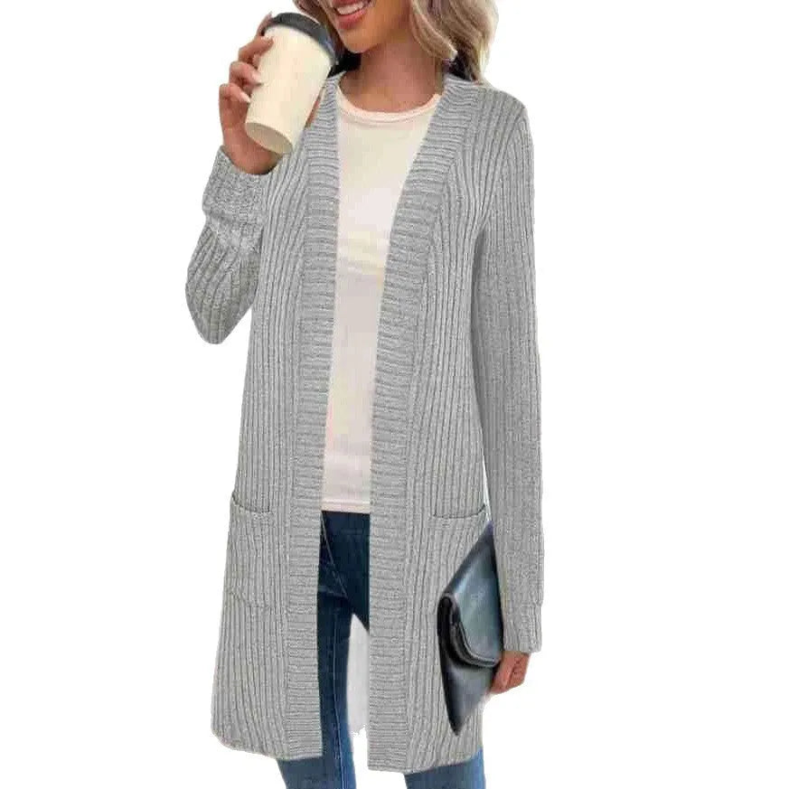 Long sleeve loose fit knitted cardigan jacket with pockets in grey.