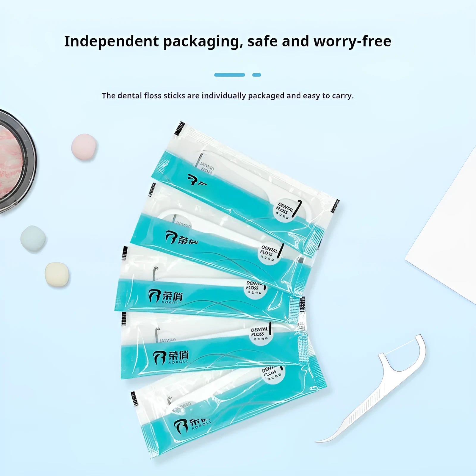 Dental floss in plastic packaging with 100 individually wrapped pieces for hygienic oral care