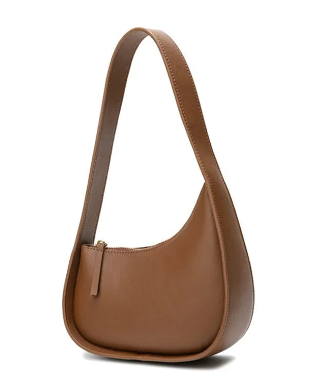 Small genuine cowhide leather half moon handbag with a wide shoulder strap.