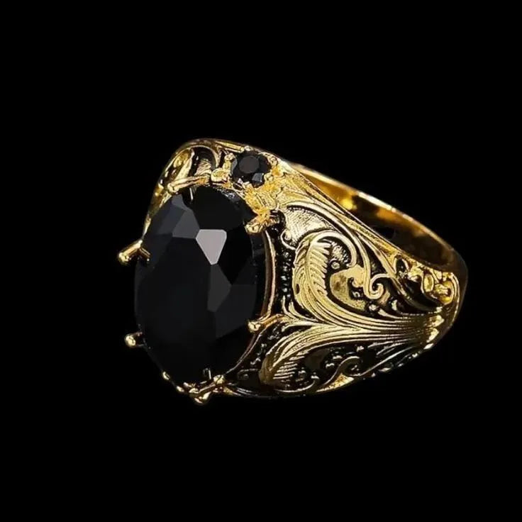 Men's silver geometric wide face ring with imitation ink gem detail on finger.