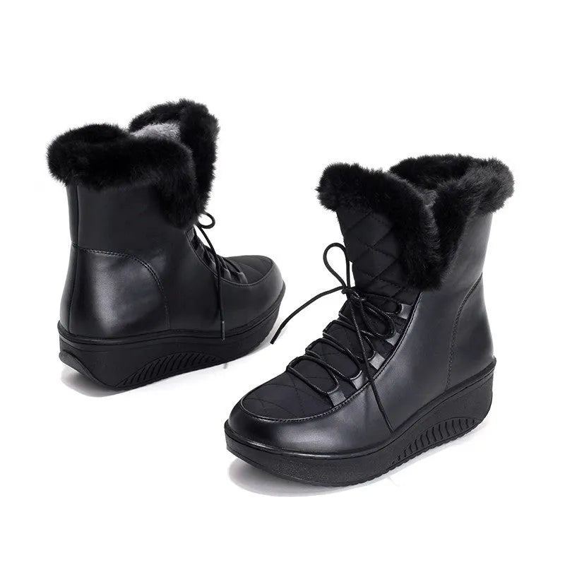 Women's black lace-up winter boots with a platform heel on a white background.