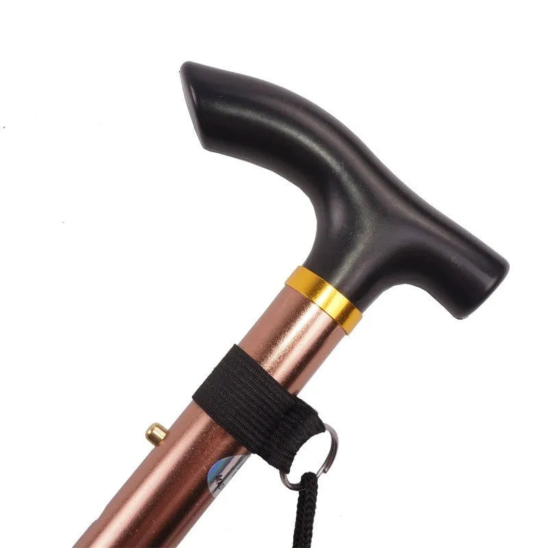 Aluminium folding walking stick adjusted to mid-length, showing non-slip rubber tip.