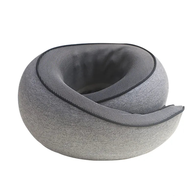 A U-shaped memory foam neck pillow in a modern simplicity style, shown with its included storage bag.