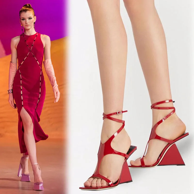 Women's black high heel sandals with a square toe and button strap fastening.