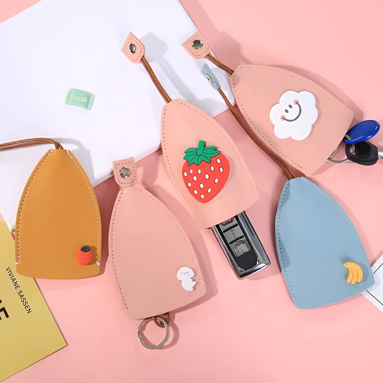 Cartoon patterned pull-out car key case made from PU leather, showing the open design.