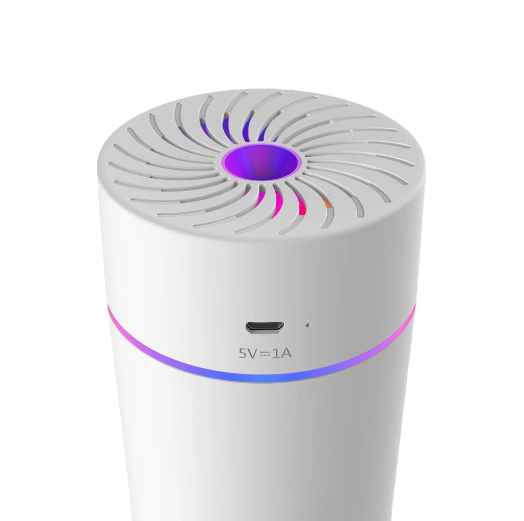 Compact white car USB humidifier with aromatherapy function shown in vehicle cup holder