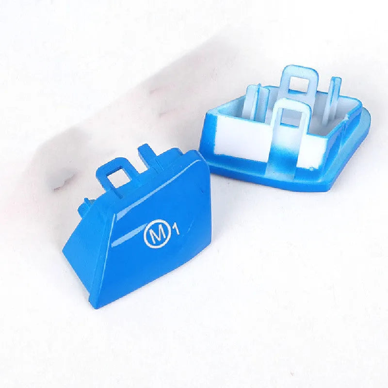 Red and blue BMW steering wheel M1 M2 mode replacement button set with installation keys.