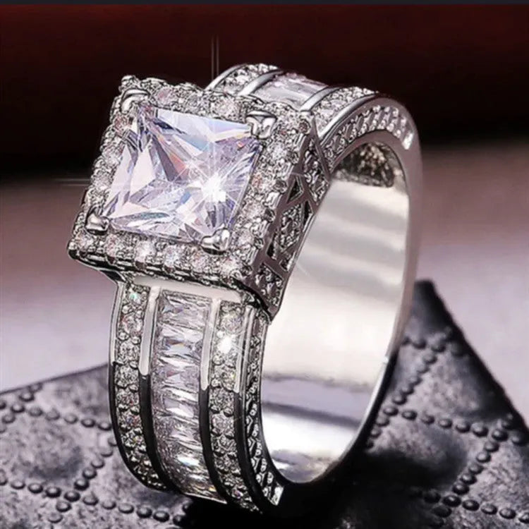 Electroplated alloy women's geometric engagement ring in gold or white colour on size display