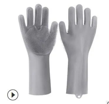 Blue silicone cleaning gloves with textured scrubbing patterns on fingers and palms.