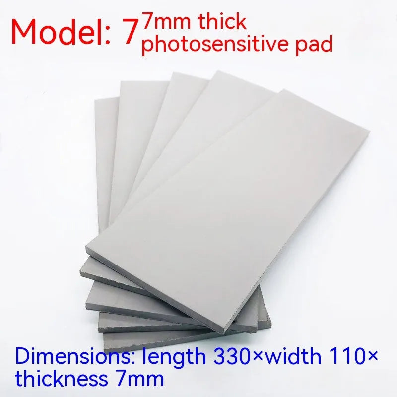 Black and gray plastic light-sensitive mat for seal making measuring 330mm by 110mm